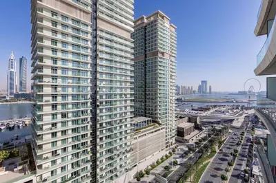 an aerial view of a tall building in a city at 2 BR, private beach access, sea view, Emaar beach front in Dubai