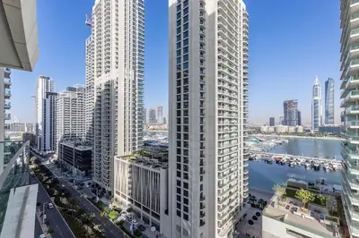 an aerial view of a city with tall buildings at 2 BR, private beach access, sea view, Emaar beach front in Dubai
