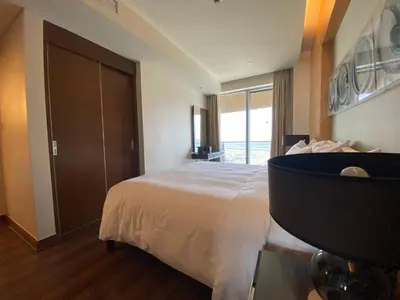 a bedroom with a bed and a large window at SuperHost EMAAR Residences Fashion Avenue - Former Address Dubai Mall Studio's & 1 BR in Dubai