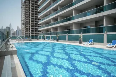 a swimming pool on the roof of a building at Modern Studio in Elite Business Bay Residence in Dubai