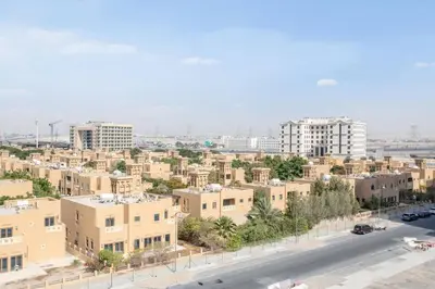 an aerial view of a city with buildings at VacayLettings - 1 BHK - Near Jebel Ali Port- IKEA - Metro 20 Min - Al Furjan in Dubai