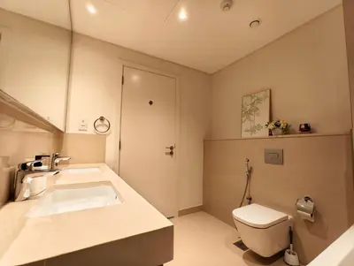 a bathroom with a sink and a toilet at Downtown Views 2 - Burj Khalifa View in Dubai