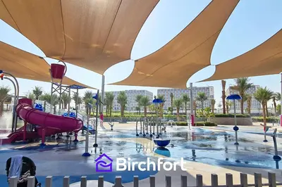 a playground at a resort with a slide at Birchfort - Elegant 1BR Furnished at Mulberry in Dubai