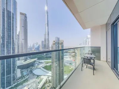 a balcony with a view of a city at TRPS - Act One Act Two Towers, Downtown Dubai, Iconic 3BR plus Maids - with Burj Khalifa Views - Near Dubai Mall in Dubai