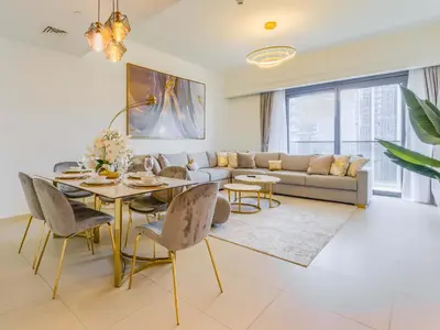a living room with a couch and a table at TRPS - Act One Act Two Towers, Downtown Dubai, Iconic 3BR plus Maids - with Burj Khalifa Views - Near Dubai Mall in Dubai
