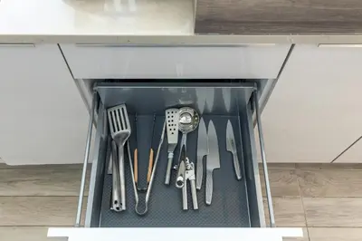 a drawer filled with knives and other kitchen utensils at Marina Gate 2 Penthouse Iconic Views in Dubai