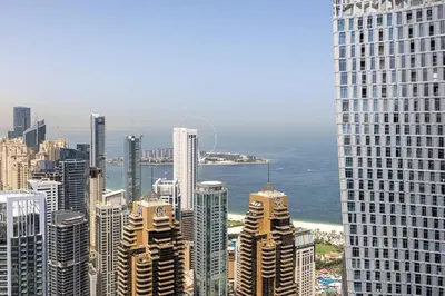 a view of a city with tall buildings and the ocean at Marina Gate 2 Penthouse Iconic Views in Dubai
