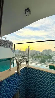 a swimming pool with a view of a city at Appartement de Luxe 1 Chambre avec Piscine Privée sur Balcon in Dubai