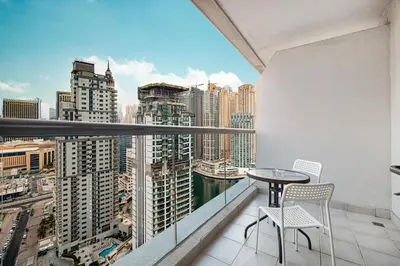 a balcony with a table and two chairs at Prime Location - Marina full View - Perfect for holidays in Dubai