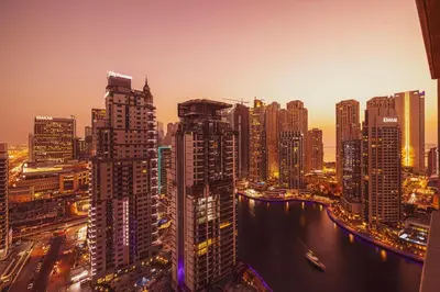 a view of a city skyline at night at Prime Location - Marina full View - Perfect for holidays in Dubai