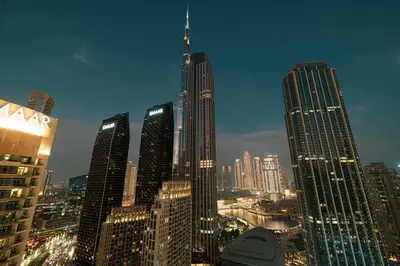a view of a city skyline with tall buildings at Spacious 4-Bedroom Apartment with Full Fountain and Burj Khalifa Views - 10 min Walk to Dubai Mall in Dubai