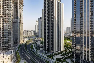 an aerial view of a city with tall buildings at Alluring 1BDR apartment in Dubai Creek Harbour in Dubai