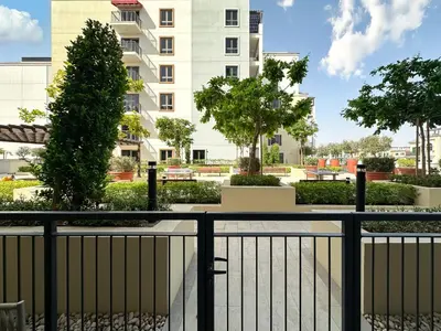 a view of a building from a balcony at Chic 1BR on La Mer Upgraded & Elegant in Dubai
