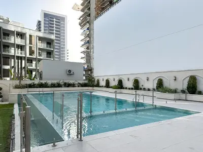 a swimming pool in the middle of a building at Elegant 2BR Plus Guest Room Stay with Designer Interior in Dubai