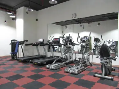 a gym with a bunch of exercise bikes in a room at Luxury 1BR by dubai marina walk! in Dubai