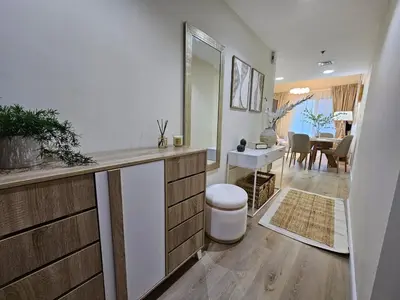 a bathroom with a counter and a room with a table at Luxury 1BR by dubai marina walk! in Dubai