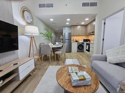 a living room with a couch and a table at Luxury 1BR by dubai marina walk! in Dubai
