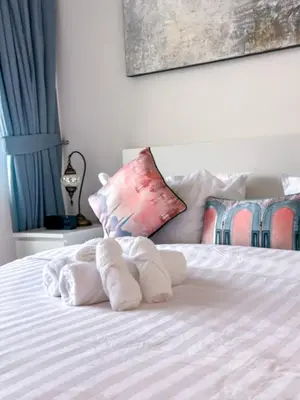 a towel animal made out of towels on a bed at Downtown Views II 2 Bedroom Apartment Next to Dubai Mall in Dubai