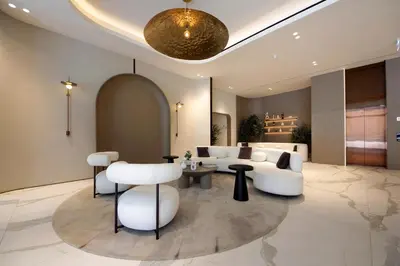 a living room with a couch and a table at Contemporary JVC Studio with Rooftop Pool Gym in Dubai