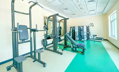 a gym with several tread machines in a room at Apartment Close to Metro in Dubai Marina in Dubai