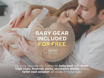 a man and a woman holding a baby at SettlerHomes - Private Jacuzzi Oasis on the High-Floor in Dubai