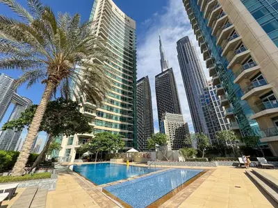 a pool in the middle of a city with tall buildings at The Lofts, Burj Khalifa View in Dubai
