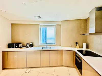 a kitchen with a sink and a window at Luxe 3BR , Paramount by DAMAC, Excellent Pool in Dubai