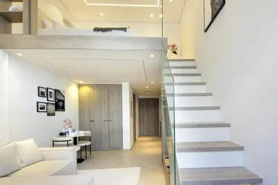 a staircase leading to the second floor of a house at Modern Loft Studio JVC ,Stylish & Fully Furnished in Dubai