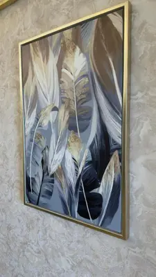 a picture of a painting of feathers on a wall at Highend Azure 1BR Sea View and Private Beach with Pool Access in Dubai