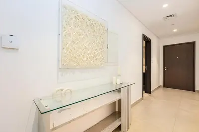 a glass counter in a room with a hallway at FIRST CLASS 1BR Stylish Gem Near Dubai Mall in Dubai