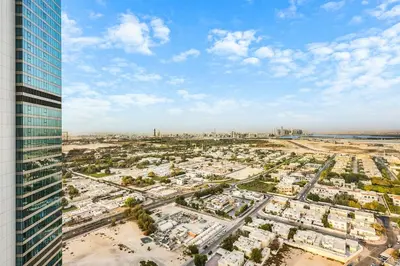 an aerial view of a city with a tall building at FIRST CLASS 1BR Stylish Gem Near Dubai Mall in Dubai