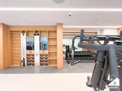a fitness room with a gym with a treadmill at Seafront Serenity Palm Escape with Pool Access in Dubai