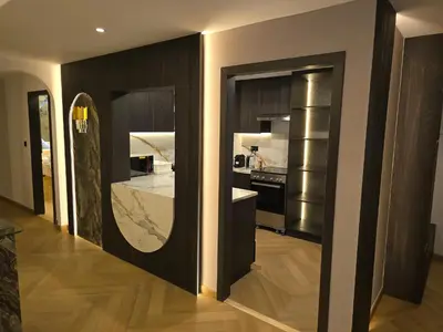 a kitchen with a large mirror in a room at Highend 2BR Skyline View with Beach JBR in Dubai