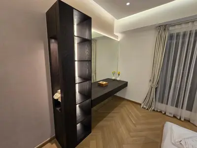 a room with a black book shelf and a window at Highend 2BR Skyline View with Beach JBR in Dubai