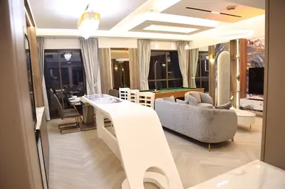 a living room with a couch and a table at Highend 2BR Sea and Beach View in Dubai