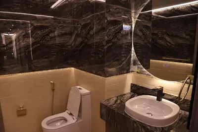 a bathroom with a toilet and a sink at Highend 2BR Sea and Beach View in Dubai