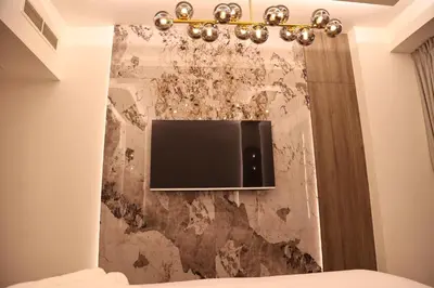 a tv on a wall in a room at Highend 2BR Sea and Beach View in Dubai