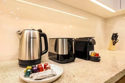 a kitchen with two coffee machines on a counter at Stylish 2BR Downtown Dubai with Skyline & Burj Khalifa Views in Dubai