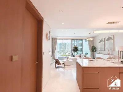 a kitchen and living room with a view of a living room at Luxury Beachfront 1BR on Palm Jumeirah & Balcony in Dubai