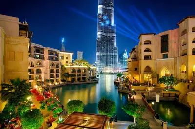 a view of a river in a city at night at Peaceful Studio Stay Canal Views Poolside Comfort in Dubai