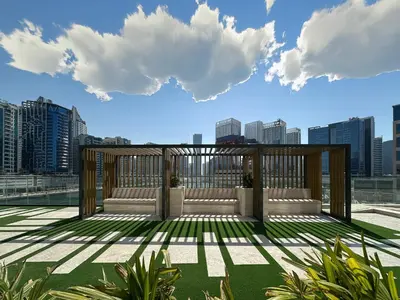 a balcony with a view of a city skyline at Peaceful Studio Stay Canal Views Poolside Comfort in Dubai