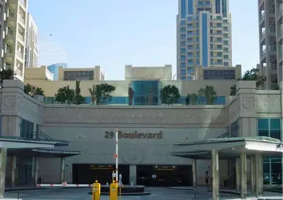 a building in a city with tall buildings at Exceptional 1BR I Burj Khalifa I Fountain View in Dubai