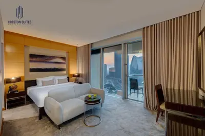 a hotel room with a bed and a couch at Exclusive 1BDR Near Burj Khalifa with Free Parking in Dubai