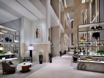 a lobby with couches and chairs in a building at Exclusive 1BDR Near Burj Khalifa with Free Parking in Dubai