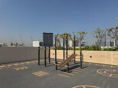 a park with a bench on top of a building at Luxe Escape - Stylish 1BR in Binghatti Venus-05 in Dubai
