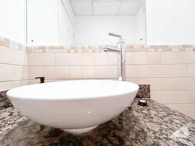 a white bath tub sitting on a counter in a bathroom at Stunning 4 bedroom with Breathtaking Sea View JBR in Dubai