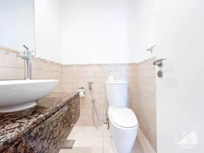 a bathroom with a white toilet and a sink at Stunning 4 bedroom with Breathtaking Sea View JBR in Dubai