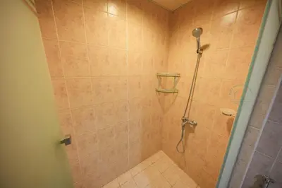a bathroom with a shower with a shower head at Luxury 2-Bedroom Stay in the Heart of Churchill in Dubai