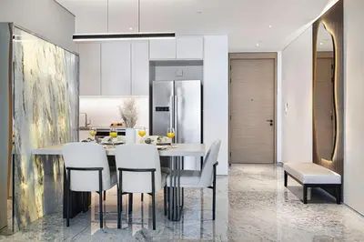 a kitchen and dining room with a table and chairs at SkyHigh Stay, Panoramic Sea Views & Beach Access in Dubai