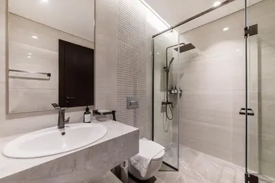 a bathroom with a sink and a shower at Nobles Tower tiger one skyline view in Dubai